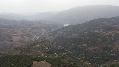 Misty-Lecrin-Valley-Granada,-Panning-left-over-mountains-and-hills