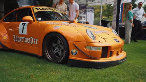 Orange-Rauh-Welt-Begriff-Built-Porsche-Parked-at-Luxury-Car-Show
