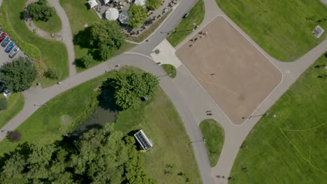 Top-down-aerial-view-of-people-playing-on-a-court-in-a-park-in-Finland-near-Helsinki