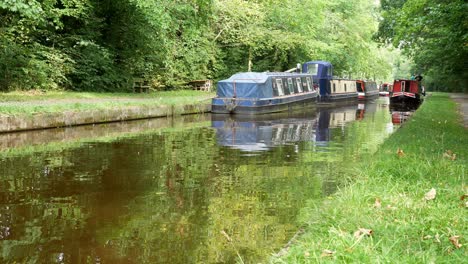 British-staycation-scenic-canal-boat-touring-tourism-holiday-vacation-waterway-idyllic-lifestyle-towards-camera