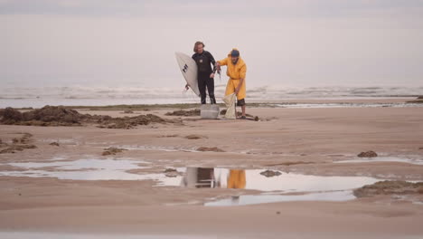 merchant-trying-to-sell-squid-to-surfer-on-Morocco-beach