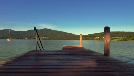 Loopable-scene-of-a-pier-leading-into-the-bavarian-Tegernsee-at-a-beautiful-summer-day