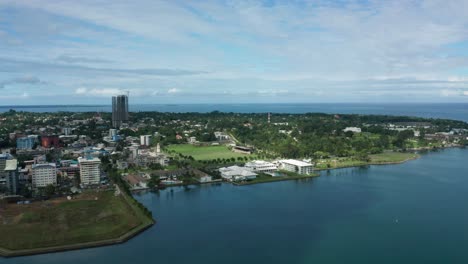 Aerial-of-peninsula-city-Suva-on-mainland-of-Fiji,-view-of-Albert-Park,-urban