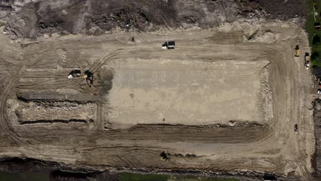Aerial-circling-shot-of-a-construction-site-on-a-farm