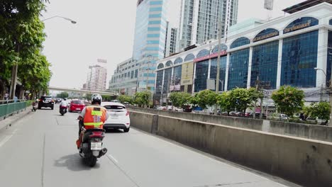 Motorcycle-Taxi,-Bangkok,-along-Ratchada-road,Thailand