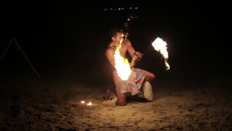 Male-Performer-Fire-Dancing-on-the-Beach-at-Night