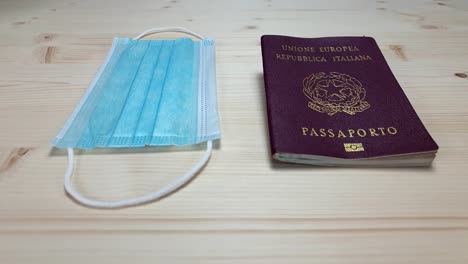 Passport-and-face-mask,-two-essential-travel-items-during-a-pandemic