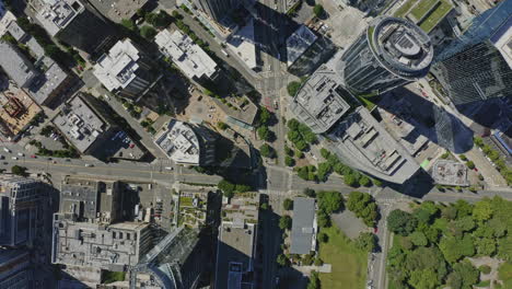 Seattle-Washington-Aerial-v131-dolly-out-down-shot-of-Denny-Way-street,-South-Lake-Union-buildings-and-park---June-2020