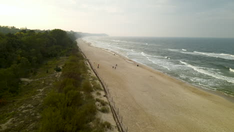 People-enjoying-the-beach-of-Wladyslawowo-in-Poland--aerial