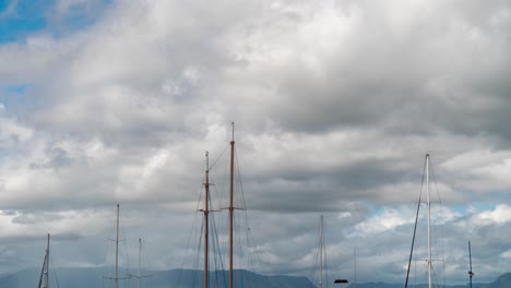 Timelapse-of-clouds-in-sky-with-masts-of-sailboats-in-harbor-of-Fiji