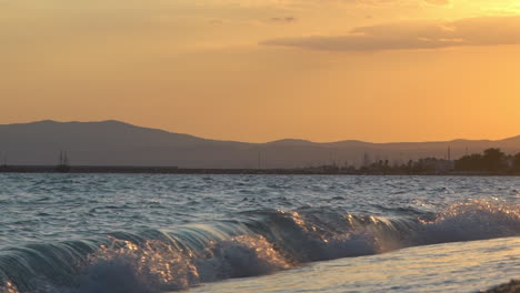 Beautiful-sunset-at-Kalamata-beach,-summer-of-2020,-low-ground-view-slow-motion-120fps