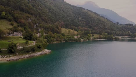 Picturesque-coastline-of-Lake-Ledro-in-Northern-Italy-at-dawn,-aerial-view