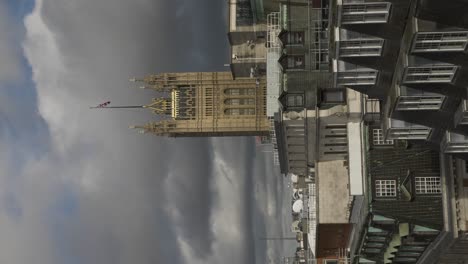 Victoria-Tower-In-London-With-Flag-Against-Dramatic-Clouds