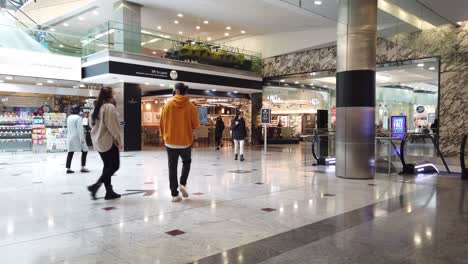 Few-people-walking-around-close-shopping-mall