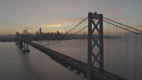 An-aerial-view-of-a-bridge-and-metropolitan-city-at-dawn