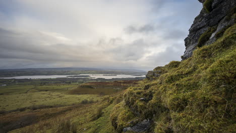 Time-lapse-of-rural-and-remote-landscape-of-grass,-trees-and-rocks-during-the-day-in-hills-of-Carrowkeel-in-county-Sligo,-Ireland