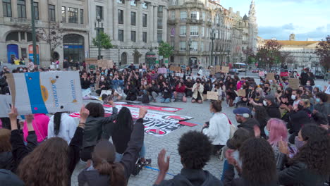 Porto-Portugal---june-6th-2020:-BLM-Black-Lives-Matter-Protests-Demonstration-camera-pan-over-crowd-protesting-with-masks