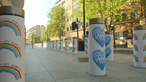 Lockdown-in-London,-bollards-show-Thank-You-NHS-and-Key-Workers-signs-on-the-deserted-streets-of-London-Bridge-Station,-during-the-COVID-19-pandemic-2020