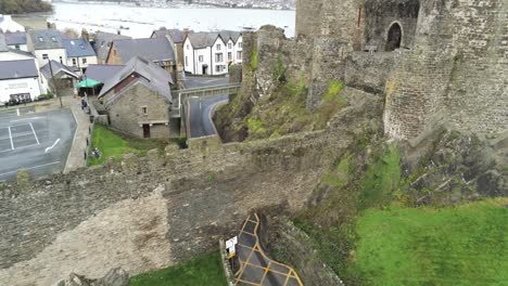 Historical-medieval-Conwy-castle-landmark-aerial-tilt-up-pan-right-view