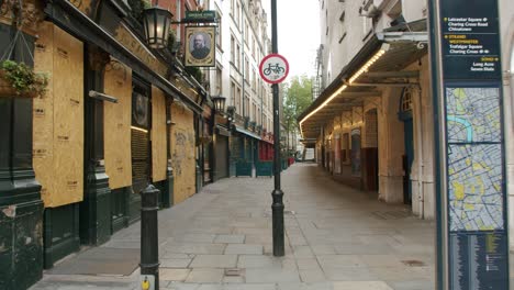 Lockdown-in-London,-empty-Covent-Garden,-West-End-streets-with-shut-theatres-and-restaurants,-during-the-Coronavirus-pandemic-2020