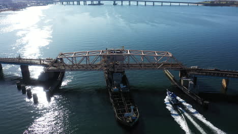 An-aerial-shot-of-a-swing-bridge-over-s-bay-in-Queens,-NY