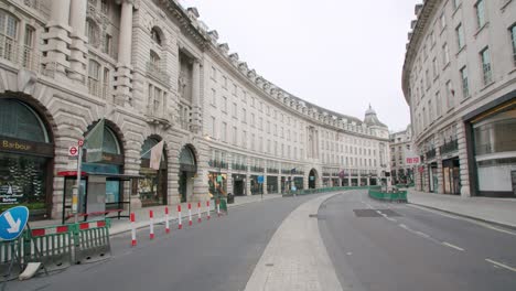 Lockdown-in-London,-desolate-Regent-Street-completely-empty-streets-during-the-Coronavirus-pandemic-2020,-on-an-overcast-day