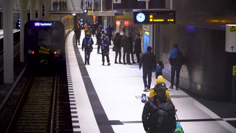 People-Waiting-on-Platform-of-Modern-Train-Station-in-Berlin-City