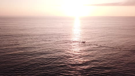 Boat-Cruising-In-The-Ocean-Near-Olon-Beach-In-Ecuador-At-Sunset
