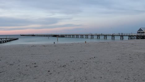 Tourists-Walking-on-Busselton-Jetty-Pier-at-Sunset-on-Australia-Beach