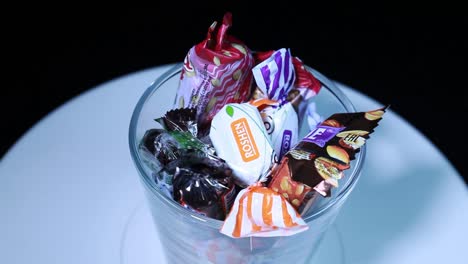 The-candy-in-a-glass-container-rotates-on-a-tray