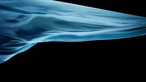 Light-Blue-Silk-In-Floating-Motion,-Isolated-In-Black-Background---studio-shot