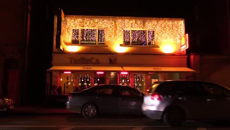 Still-or-locked-down-video-of-well-know-Dublin-restaurant-with-Christmas-decoration-cars-and-people-passing-by