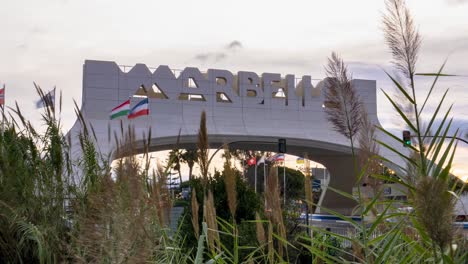 Marbella-sign-time-lapse,-well-knowen-white-stone-Marbella-arch