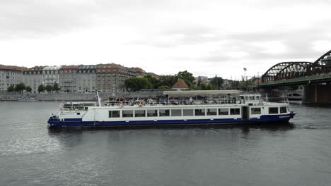 People-Cruising-On-A-Tourist-Boat-Ride-On-The-Vltava-River-In-Czech-Republic