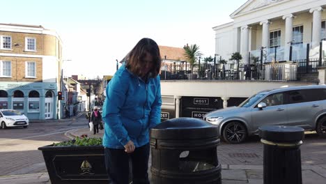 Young-girl-puts-rubbish-in-bin-Bishop-Stortford-UK