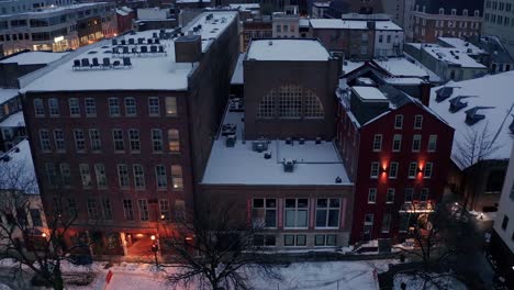 Aerial-of-apartment-building-and-business-restaurant-in-winter-snow