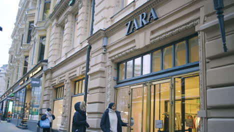 Static-slomo-shot-of-women-entering-Zara-store-on-street-in-Helsinki