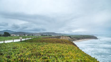 Time-Lapse:-cloudy-day-at-the-beach-by-the-cliffs