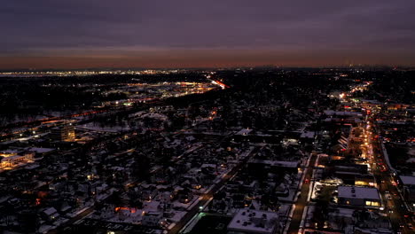 an-aerial-time-lapse-with-traffic-in-motion,-just-after-sunset-as-night-falls