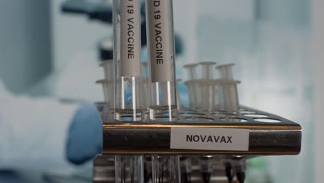Novavax-Covid-Vaccine-Test-Tube-Vials-Being-Placed-Into-Rack
