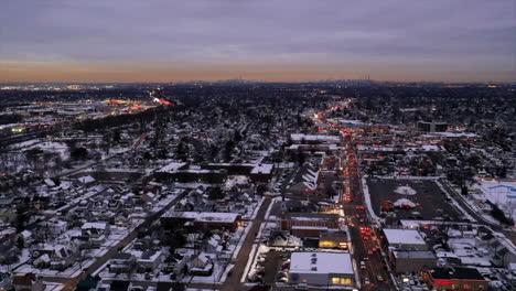 an-aerial-time-lapse-with-traffic-in-motion,-just-after-sunset-as-night-begins-to-fall
