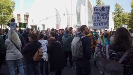 Protesters,-holding-placards-and-posters,-waiting-for-a-fridays-for-future-march-to-start