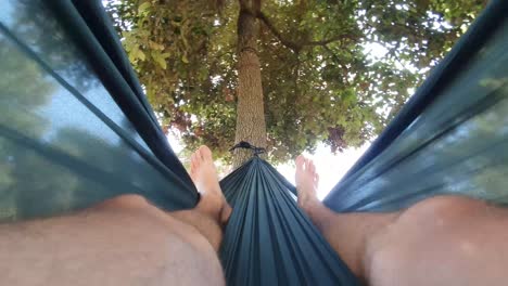 Relaxing-in-the-hammock,-nude-feet-close-up,-summer