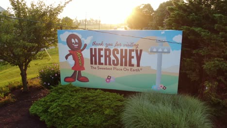 Trucking-drone-shot,-Welcome-to-Hershey,-Sweetest-Place-on-Earth-billboard
