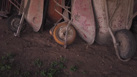 Pile-of-old-and-dirty-wheelbarrows