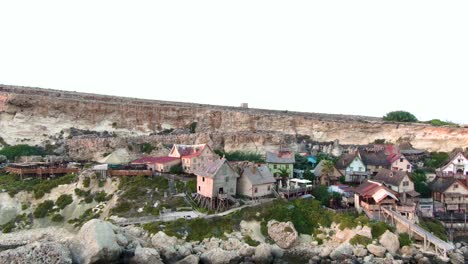 Timber-houses-of-Popeye-village-the-original-film-set-for-the-Robin-Williams-Popeye-film-converted-to-popular-entertainment-for-the-tourists