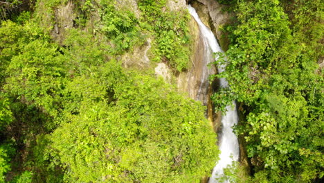 Aerial-shot-Inambakan-waterfalls-colourful-green-blue-water,-Cebu,-Philippines