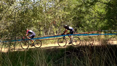 Bike-racers-going-through-a-trail-during-a-bike-race-in-Boulder,-Colorado