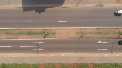 Top-down-shot-of-road-with-cars-passing