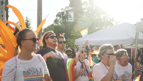 People-Marching-in-Street-With-Pride-Flags-at-River-City-Pride-Parade-in-Jacksonville,-FL